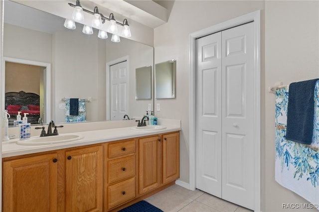 bathroom with tile patterned floors and vanity