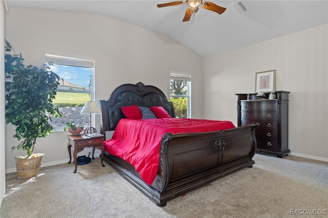 bedroom featuring ceiling fan, light colored carpet, and vaulted ceiling