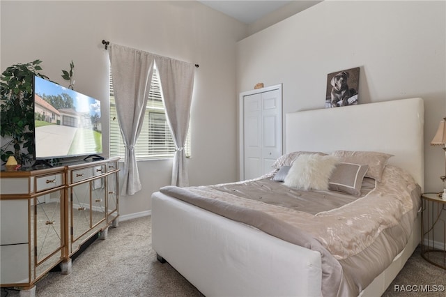 carpeted bedroom featuring a closet