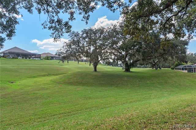 view of property's community with a lawn