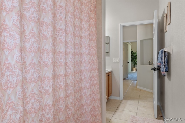 bathroom featuring tile patterned flooring and vanity