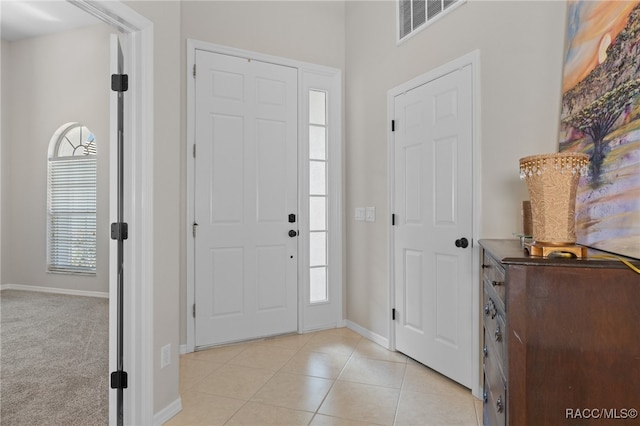 tiled entrance foyer featuring plenty of natural light