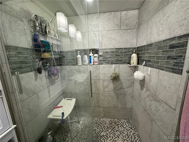 bathroom with tiled shower