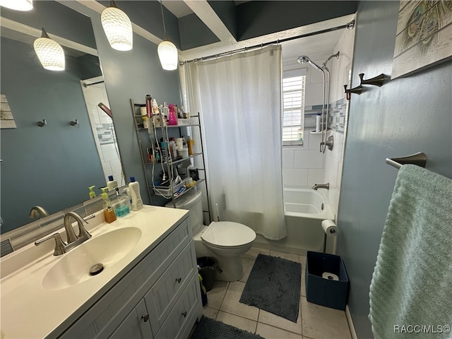 full bathroom featuring tile patterned floors, vanity, toilet, and shower / bath combo with shower curtain