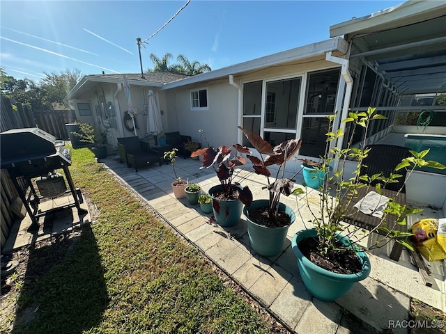 back of house featuring a patio area and an outdoor hangout area