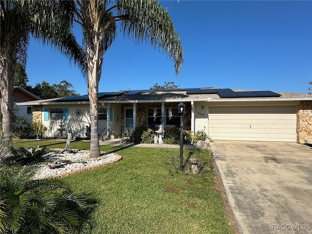 view of front facade featuring a front yard and a garage