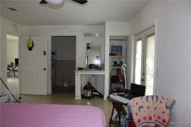 bedroom featuring concrete floors and ceiling fan