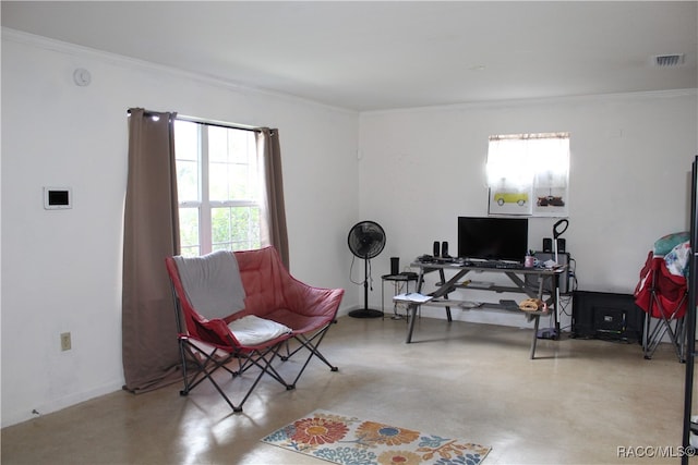 sitting room featuring ornamental molding