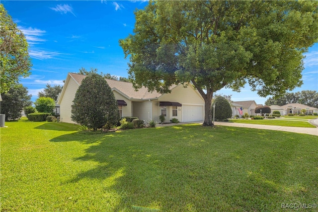 view of front facade with a garage and a front lawn