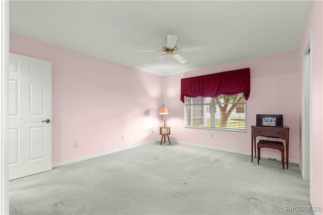 carpeted empty room with ceiling fan