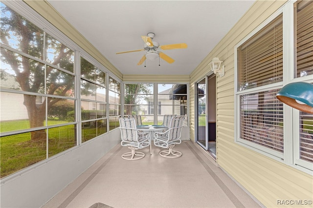 sunroom with plenty of natural light and ceiling fan