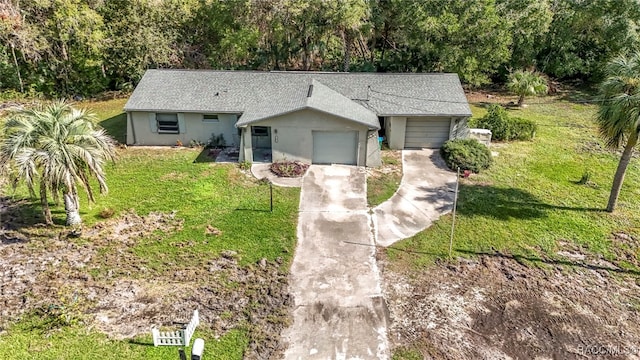 single story home with a garage and a front yard