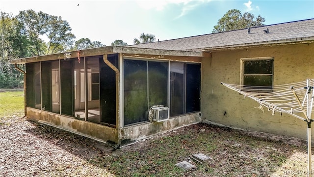 view of side of property with a sunroom