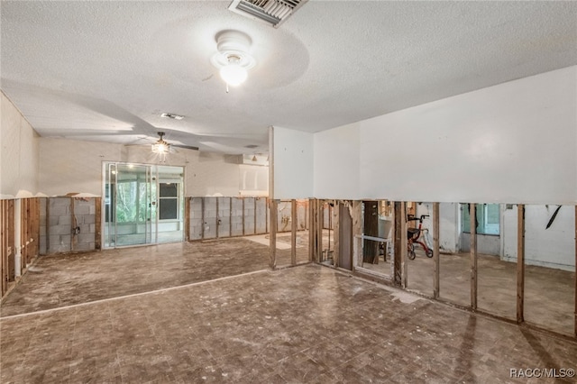 empty room featuring a textured ceiling