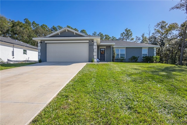 ranch-style house featuring a front yard and a garage