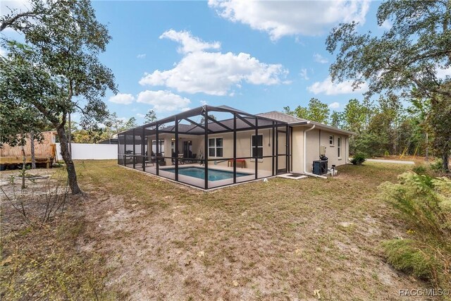 776 W Horizon Ln, Citrus Springs, FL 34434 - back of property featuring a lawn, a lanai, and stucco siding