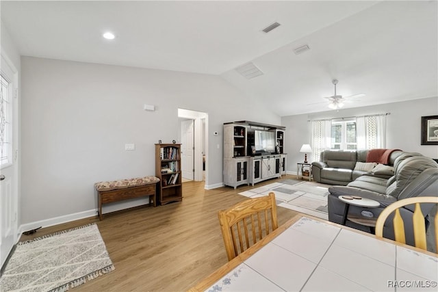 776 W Horizon Ln, Citrus Springs, FL 34434 - living area featuring lofted ceiling, light wood finished floors, a ceiling fan, and baseboards