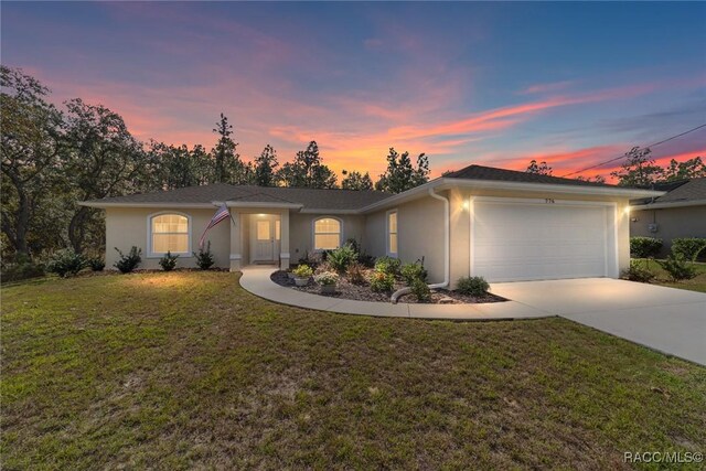 776 W Horizon Ln, Citrus Springs, FL 34434 - single story home with stucco siding, concrete driveway, a garage, and a lawn