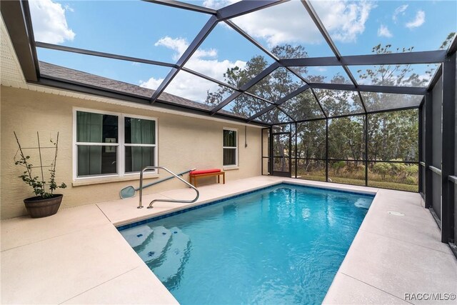776 W Horizon Ln, Citrus Springs, FL 34434 - outdoor pool featuring a patio and glass enclosure