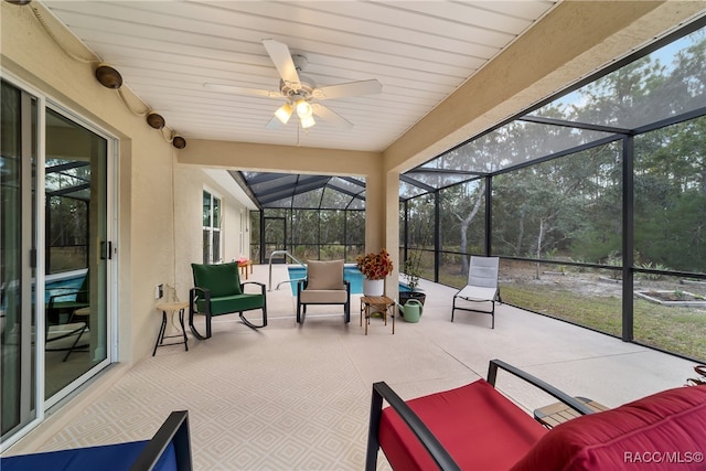 sunroom with plenty of natural light and ceiling fan