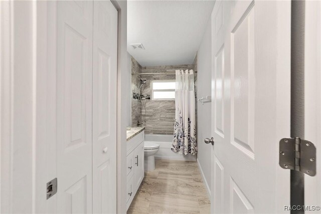 776 W Horizon Ln, Citrus Springs, FL 34434 - bathroom featuring marble finish floors, toilet, shower / bath combination with curtain, vanity, and a closet