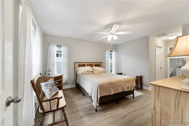 bedroom with ceiling fan and light hardwood / wood-style floors