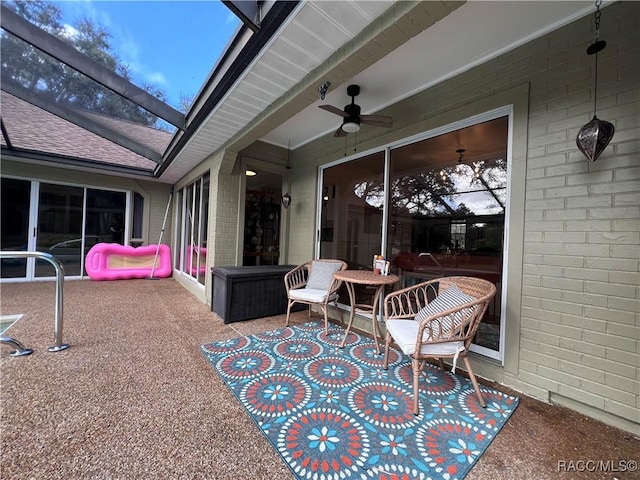 view of patio / terrace featuring ceiling fan