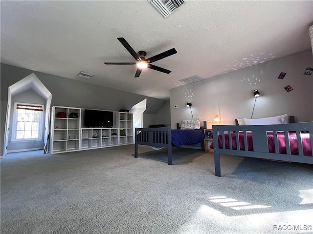 bedroom featuring ceiling fan, carpet floors, a textured ceiling, and lofted ceiling