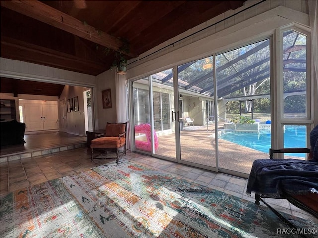 interior space featuring lofted ceiling with beams and wood ceiling