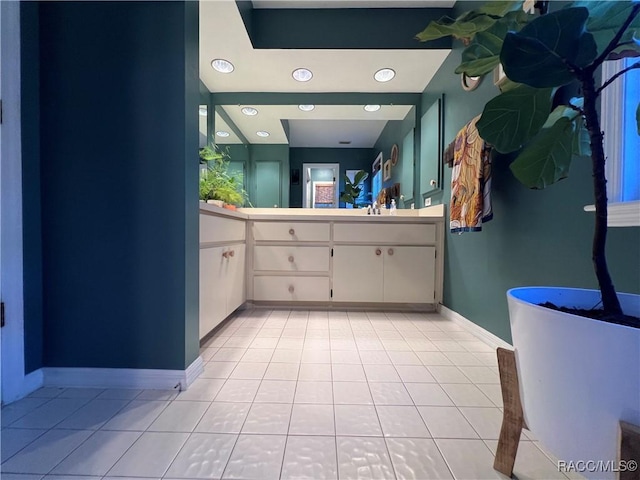 bathroom featuring tile patterned flooring and vanity