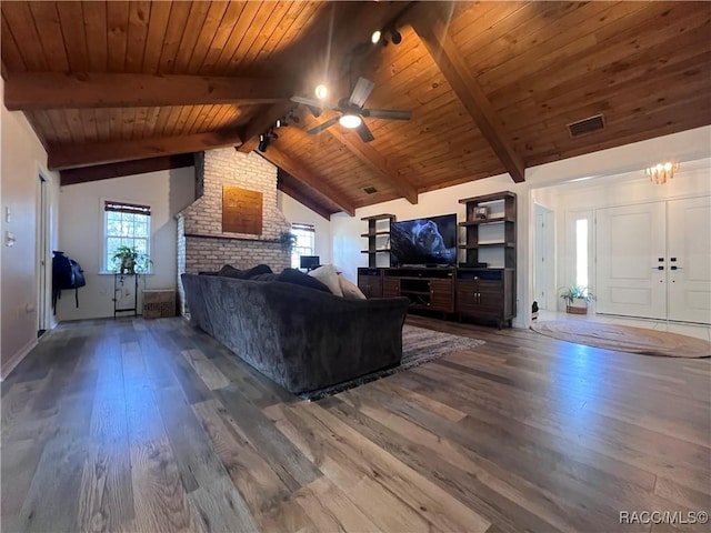 unfurnished living room featuring hardwood / wood-style flooring, lofted ceiling with beams, ceiling fan, and wood ceiling