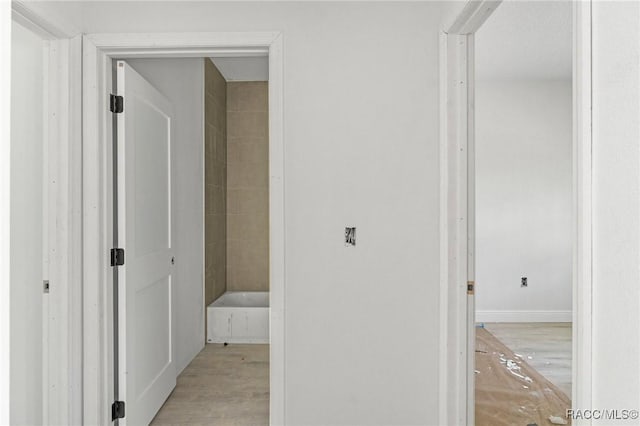 hallway with light wood-type flooring