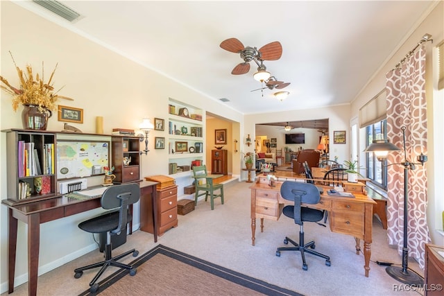 office with crown molding and light carpet