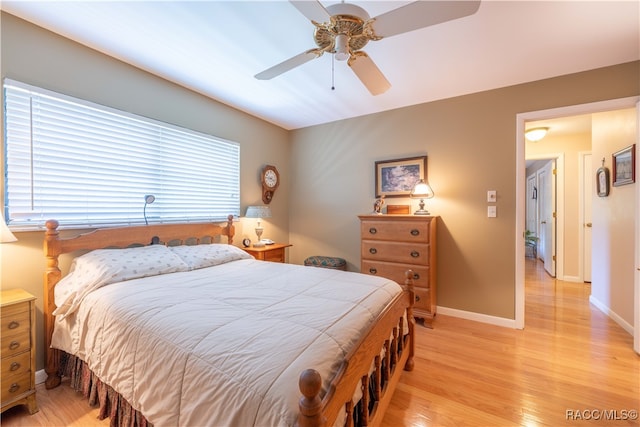 bedroom featuring ceiling fan and light wood-type flooring