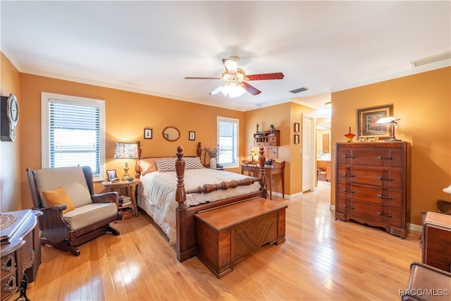 bedroom featuring ceiling fan, light wood-type flooring, ornamental molding, and multiple windows