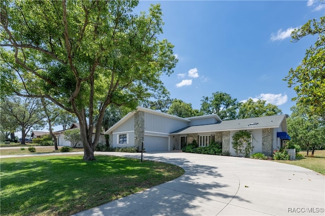 view of front facade with a front lawn and a garage