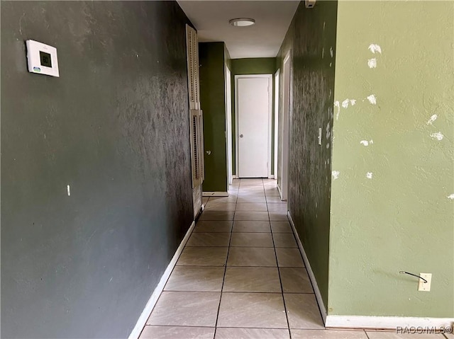 1029 NE 24th St, Ocala, FL 34470 - corridor with light tile patterned floors and baseboards
