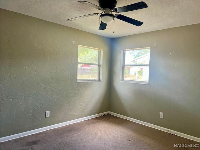 1029 NE 24th St, Ocala, FL 34470 - spare room with a ceiling fan, a textured ceiling, baseboards, a textured wall, and carpet flooring