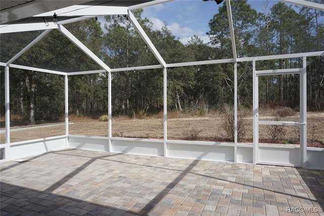 view of patio / terrace featuring a lanai