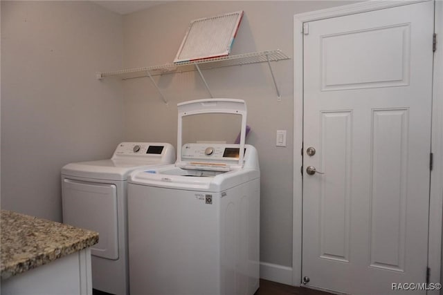 clothes washing area featuring washing machine and dryer