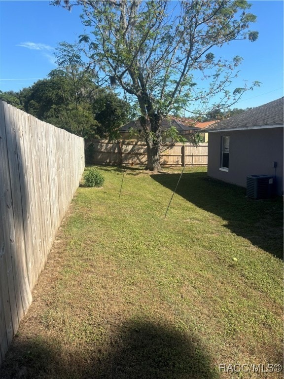 view of yard featuring central AC