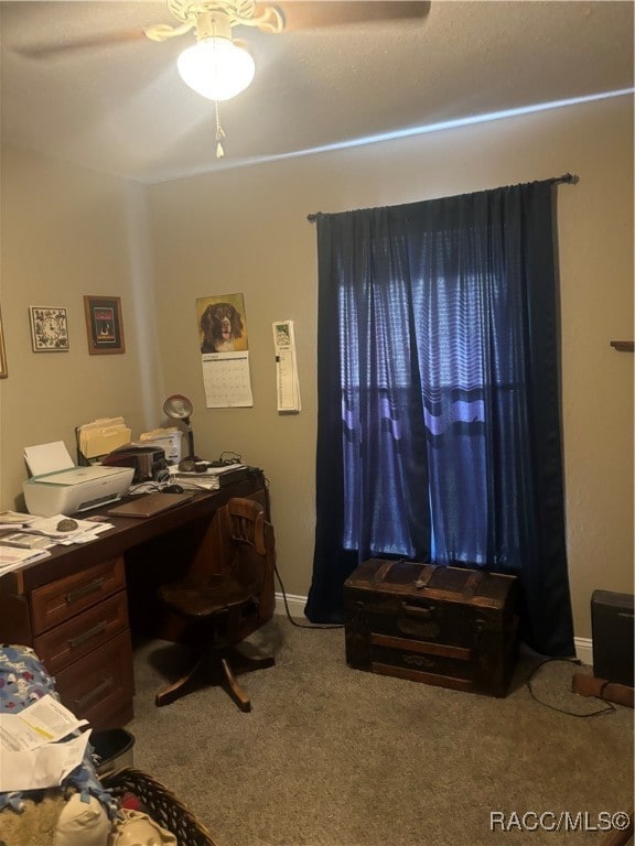 office area with carpet and ceiling fan