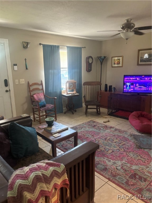 living room with ceiling fan and light tile patterned floors