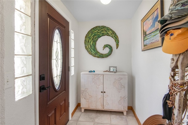 entryway with light tile patterned floors