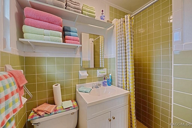 bathroom featuring vanity, tile walls, and curtained shower