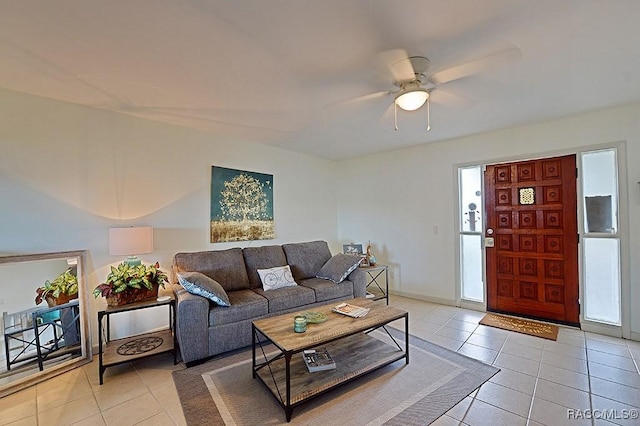 living room with light tile patterned floors and ceiling fan