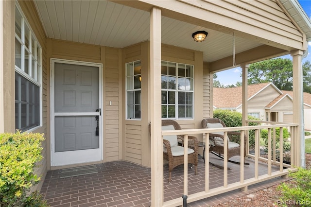 doorway to property featuring a patio area