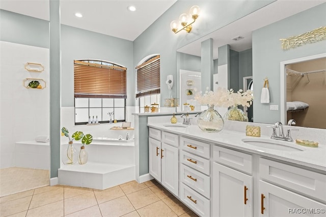 bathroom featuring vanity, tile patterned floors, and separate shower and tub