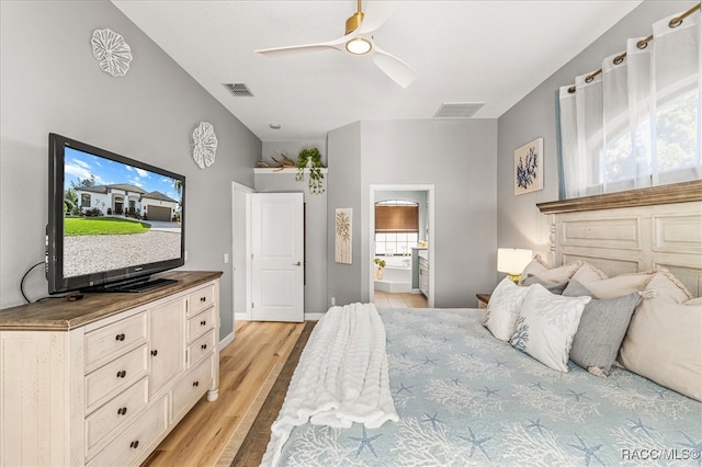 bedroom with multiple windows, ceiling fan, light hardwood / wood-style flooring, and ensuite bathroom