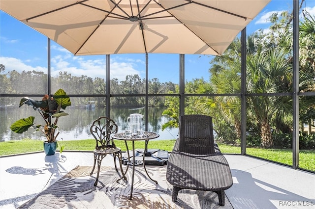 view of patio with a water view